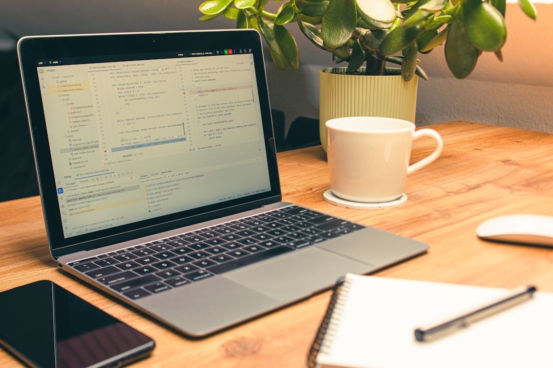 Organized office desk with legal documents, laptop, pen and coffee cup